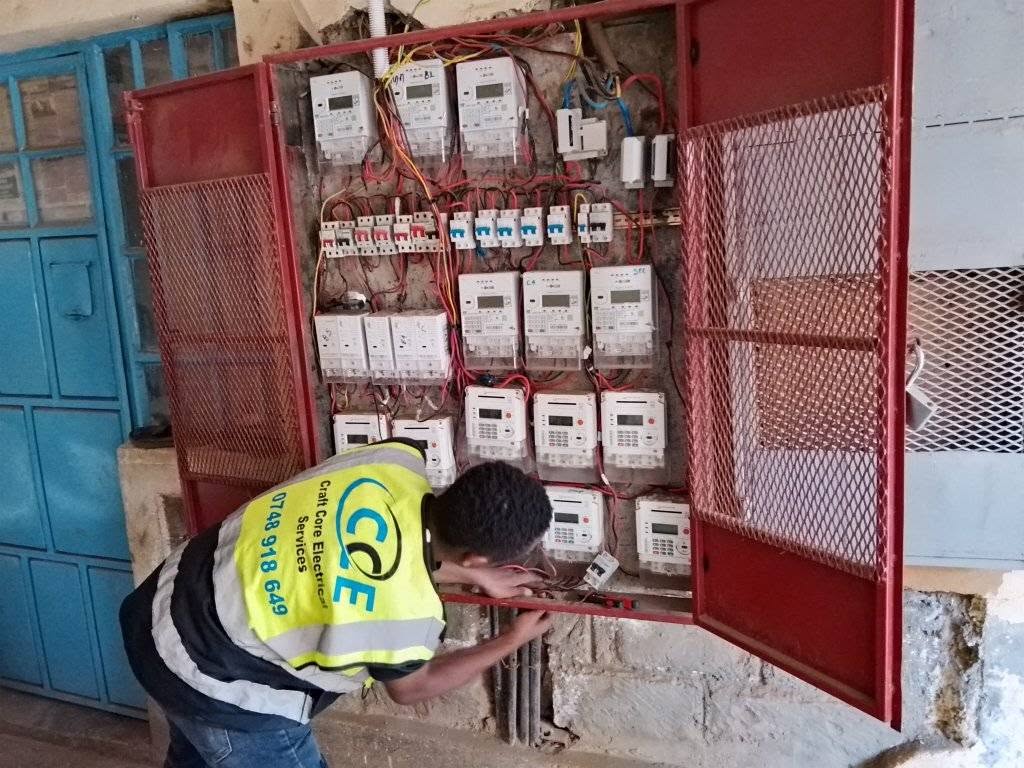 Electrician installing a KPLC electricity meter